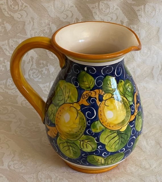 Jug with handle h20 1L with lemons on a blue background