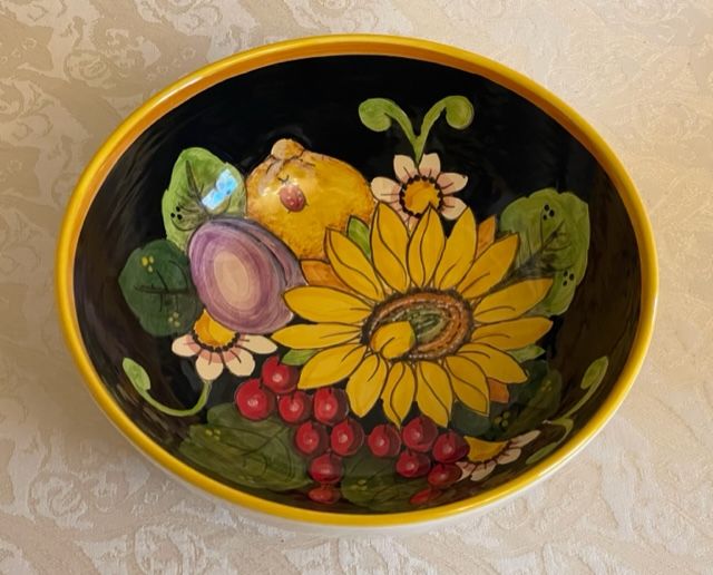 bowl D25 h9 Sunflower, lemon & grapes on a black background