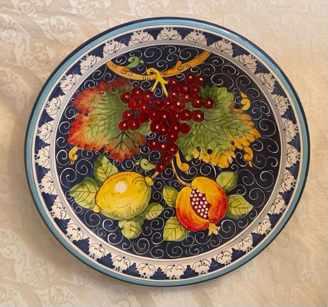 Plate with mixed fruit on a blue background D40