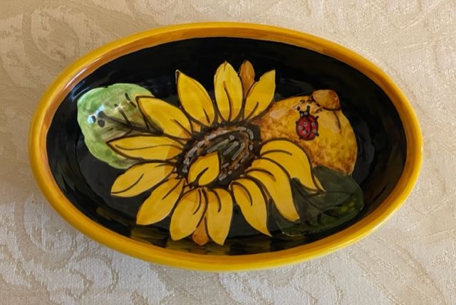 Oval bowl 14x10 h3.5 Sunflower, lemons & grapes on a black background